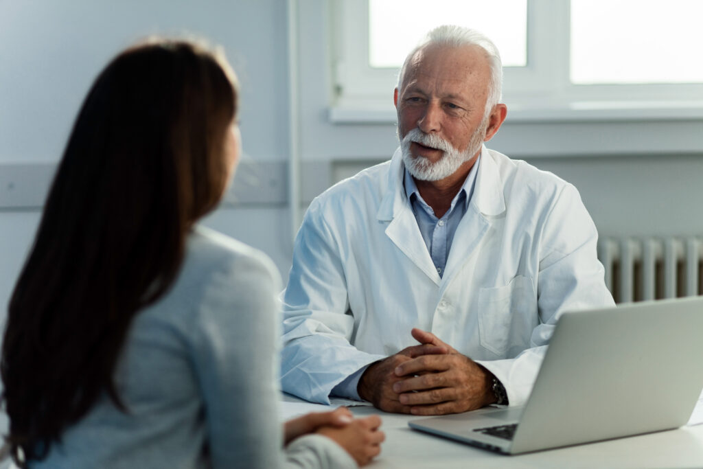 A stock image of a doctor consulting a patient.